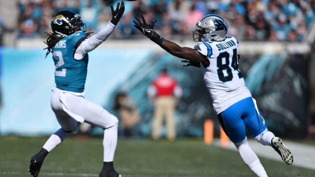 Jacksonville Jaguars safety Rayshawn Jenkins (2) and Carolina Panthers tight end Stephen Sullivan (84) try to get control of a bobbled Panthers pass during first quarter action. The Jacksonville Jaguars hosted the Carolina Panthers at EverBank Stadium in Jacksonville, FL Sunday, December 31, 2023. The Jaguars went in at the half with a 9 to 0 lead.