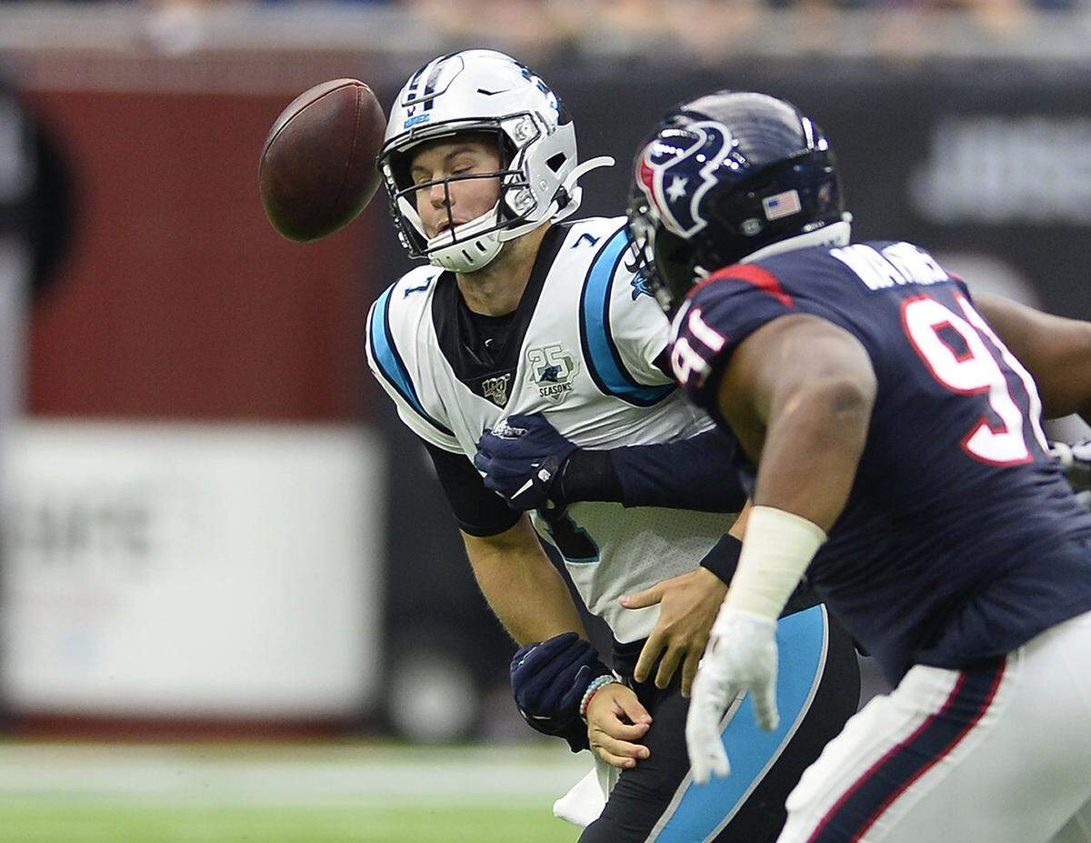 Carolina Panthers quarterback Kyle Allen (7) loses the ball as he is sacked by Houston Texans linebacker Whitney Mercilus (59) Sunday. Allen was sacked three times in the game and lost the ball on a fumble each time.