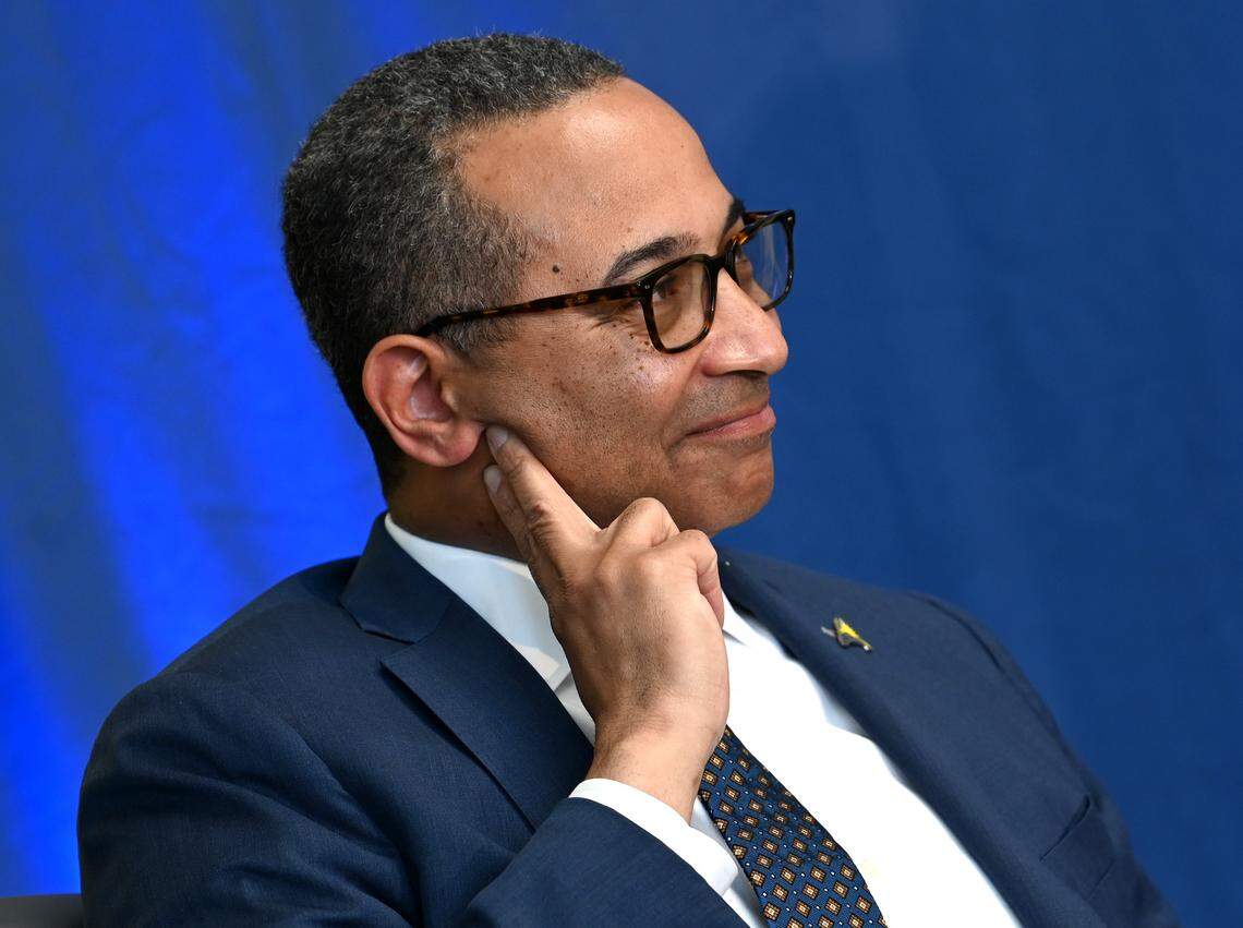 Queens University of Charlotte President Daniel Lugo listens to ASUN Conference Commissioner Ted Gumbart, during an announcement that Queens University of Charlotte would be joining the league on Tuesday, May 10, 2022. The announcement moves the Royals into NCAA Division 1 competition.