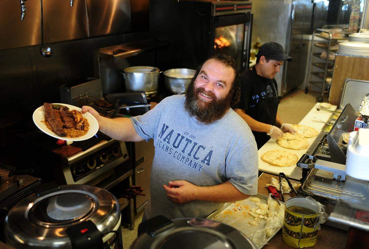In 2011, Izzat Freitekh of La Shish Kabob displayed his mixed grilled kabob entree. Over a decade later, he and his son were found guilty in federal court of crimes related to COVID fraud.