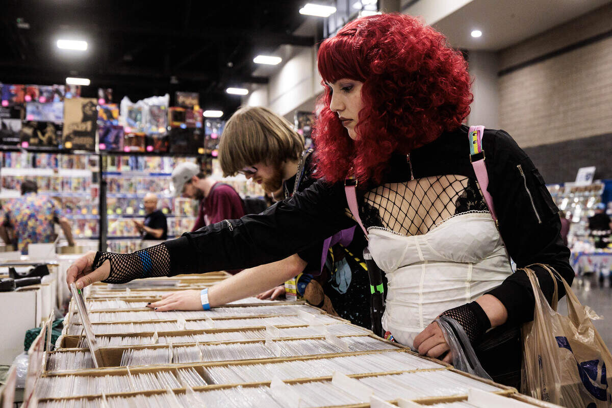 Sam Fultz, cosplaying as Typhoid Mary from Daredevil, browses comics at Heroes Convention on Friday, June 12, 2026 at the Charlotte Convention Center.