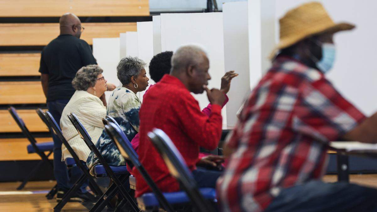 Voters cast their ballots for mid-term elections at Garinger High School on Tuesday, November 8, 2022. An election official on-site stated that by 10 AM they had a higher voter turnout than the total turnout for the past two elections.