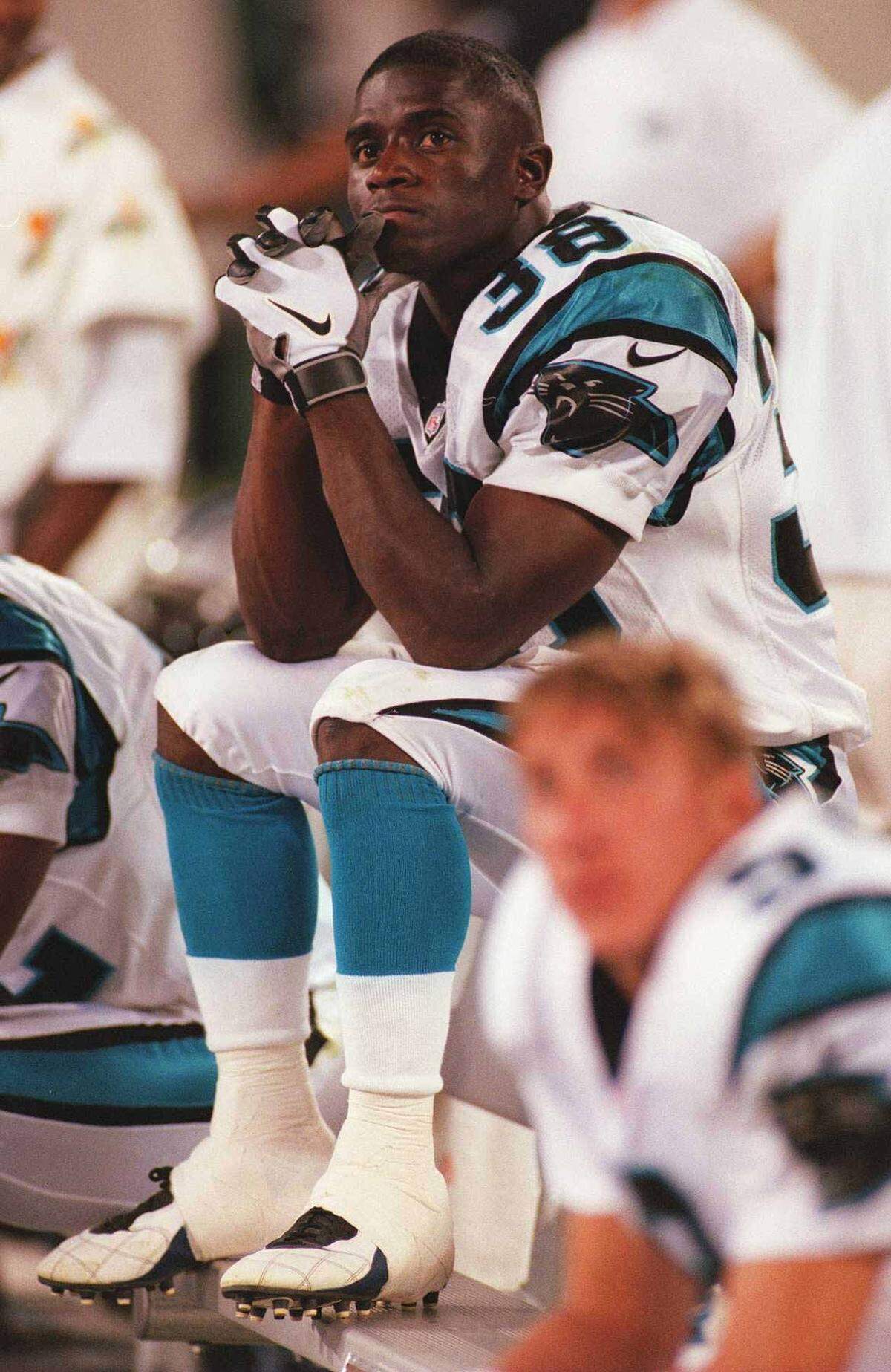 Tyrone Poole (38) sits on the sidelines during a 1997 game with the Panthers.