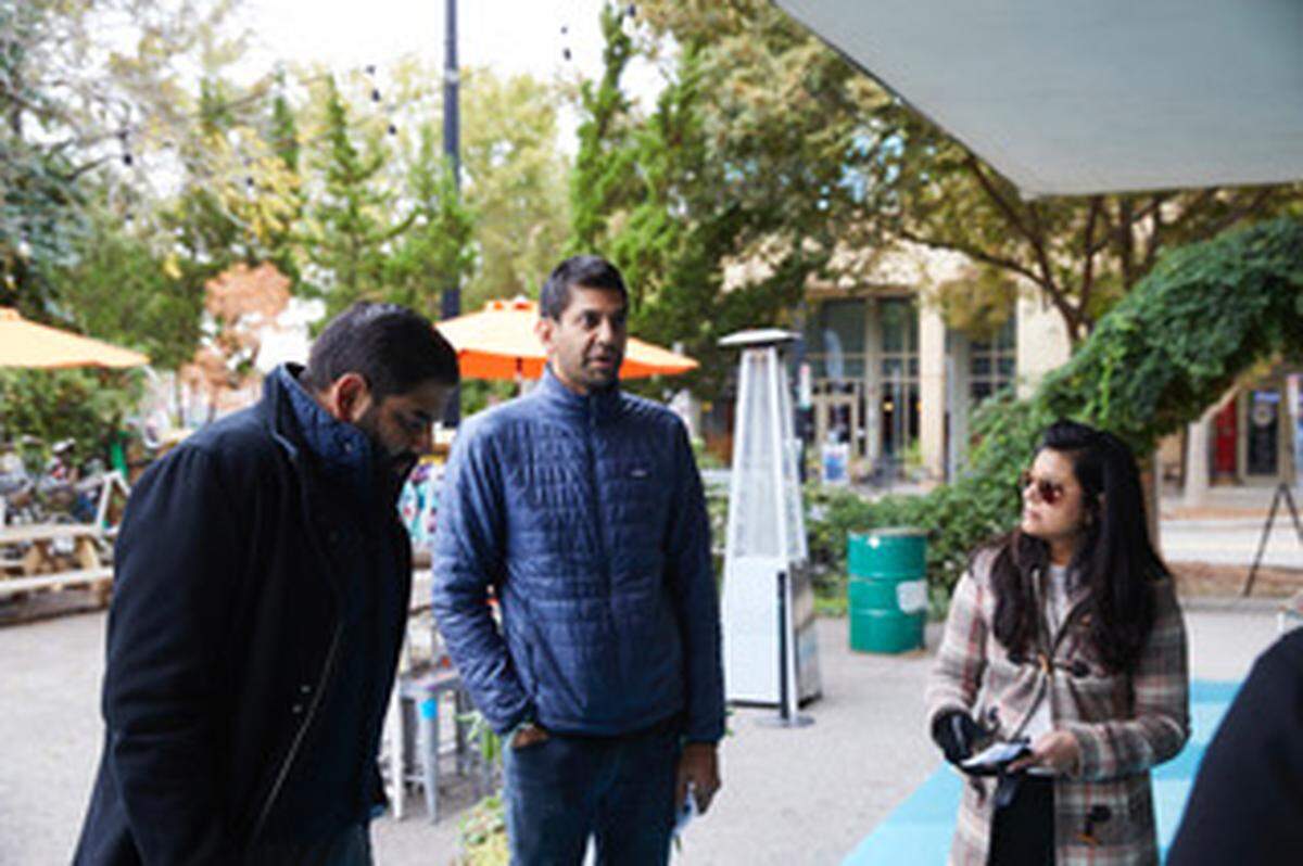 Anup Patel, left, with his brother Jay and Jay’s wife Nimisha. The trio has plans to build what would be the only hotel near the Plaza Midwood and Belmont neighborhoods.