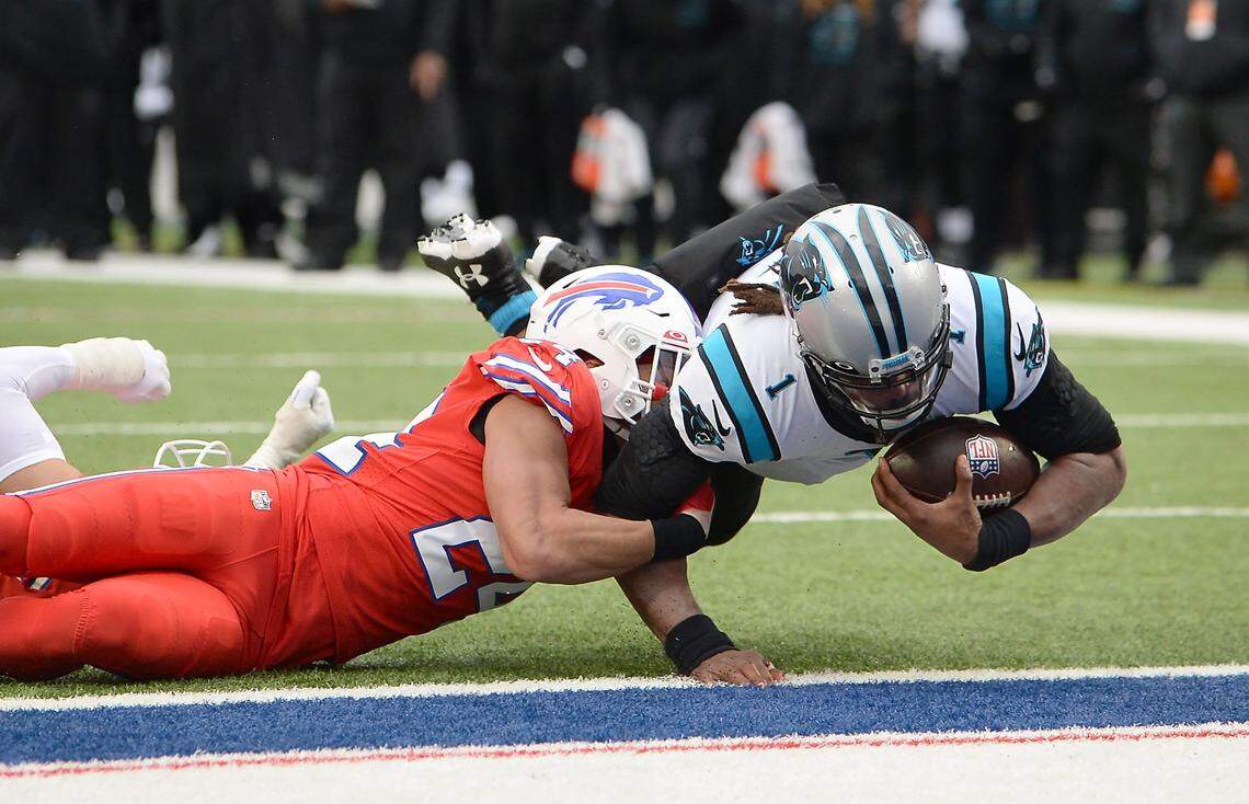 Carolina Panthers quarterback Cam Newton, right, dives into the end zone for a touchdown as Buffalo Bills safety Micah Hyde, left, attempts to make the stop during second quarter action at Highmark Stadium in Orchard Park, NY on Sunday, December 19, 2021.