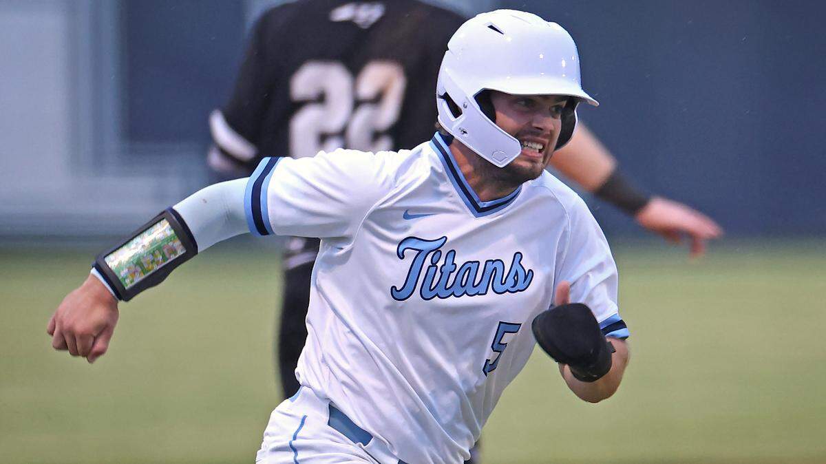 Hopewell’s Xavier Peterman grits his teeth as he rounds third base to score during prep action against Hough on Friday, April 26, 2024 at Hopewell High School.