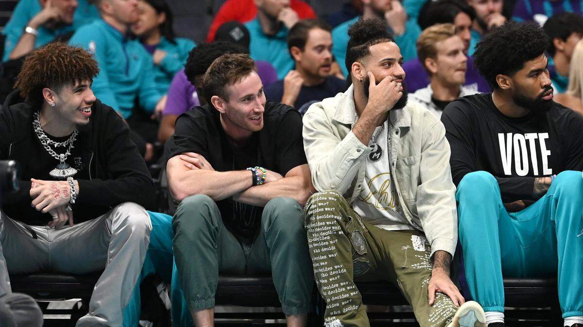 (L-R) Injured Charlotte Hornets guard LaMelo Ball, forward Gordon Hayward and forward Cody Martin sit on the team’s bench during the team’s game against the Washington Wizards at Spectrum Center in Charlotte, NC on Monday, November 7, 2022. The Wizards defeated the Hornets 108-100.