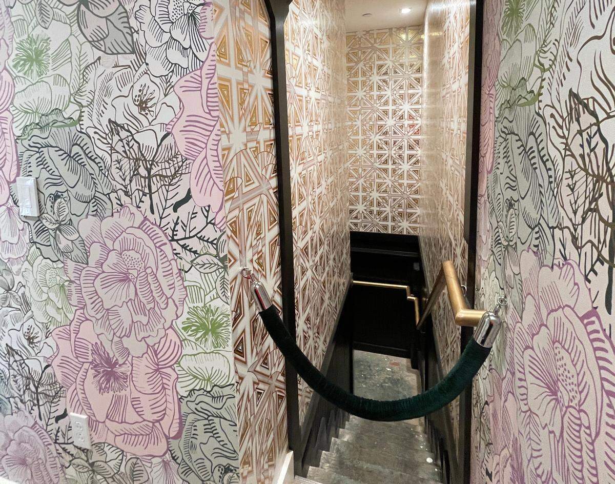 The speakeasy is tucked away underneath the bar at Supperland, and guests can access it via a narrow staircase.