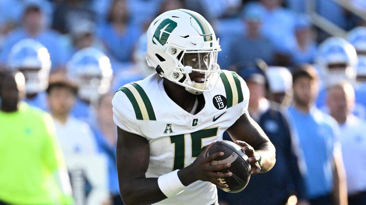 Charlotte 49ers quarterback Deshawn Purdie (15) looks to pass in the third quarter at Kenan Stadium.