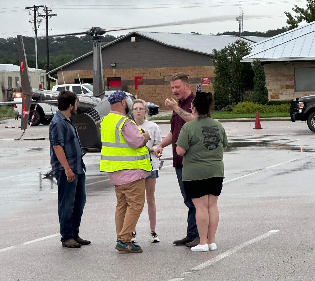 In Texas, Operations Director Natasha Rodriguez of Taylorsville, N.C., (right) meets with volunteers before coordinating missions for local Operation Helo pilots.