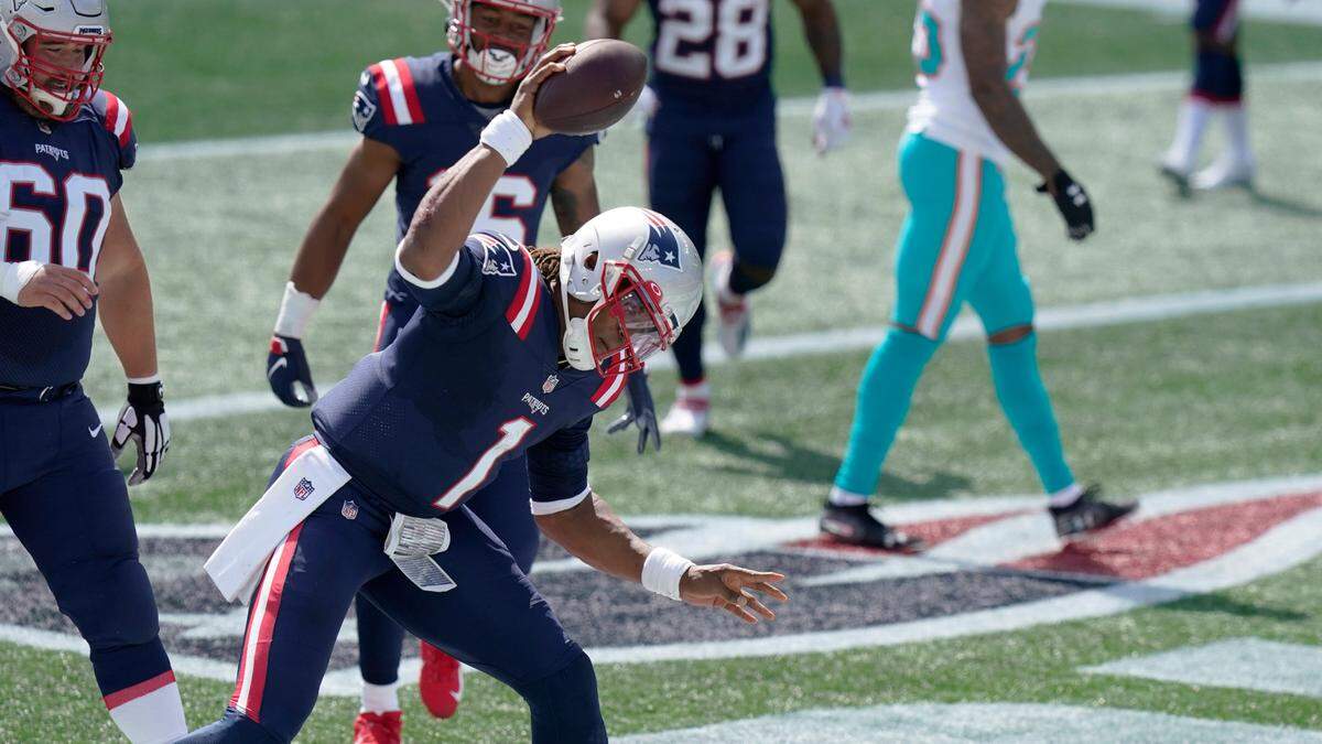 New England quarterback Cam Newton (1) has scored four rushing touchdowns in two games for the Patriots.