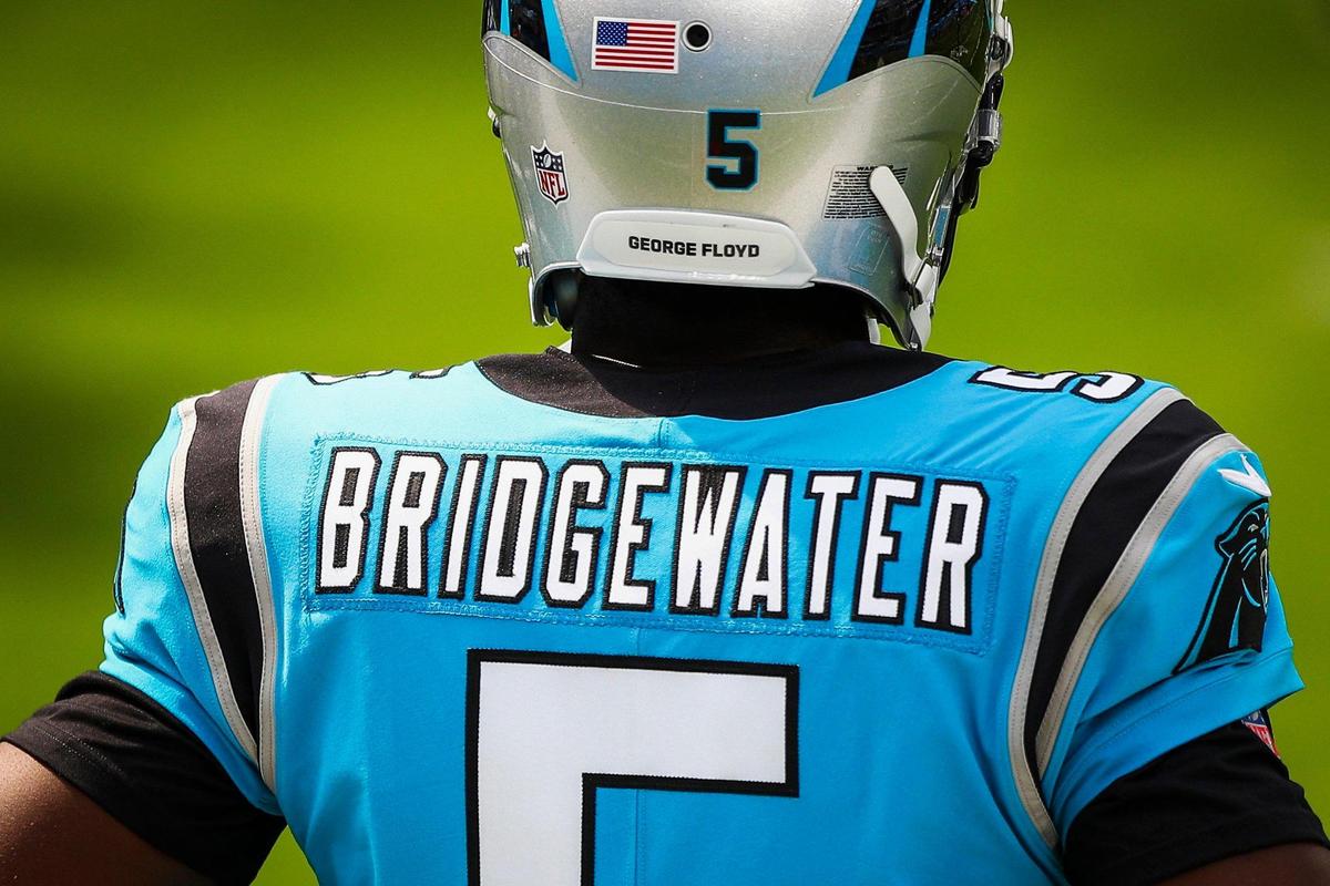 Carolina Panthers quarterback Teddy Bridgewater (5) warms up wearing a George Floyd helmet at SoFi Stadium on Sept. 27, 2020 in Inglewood, Calif.