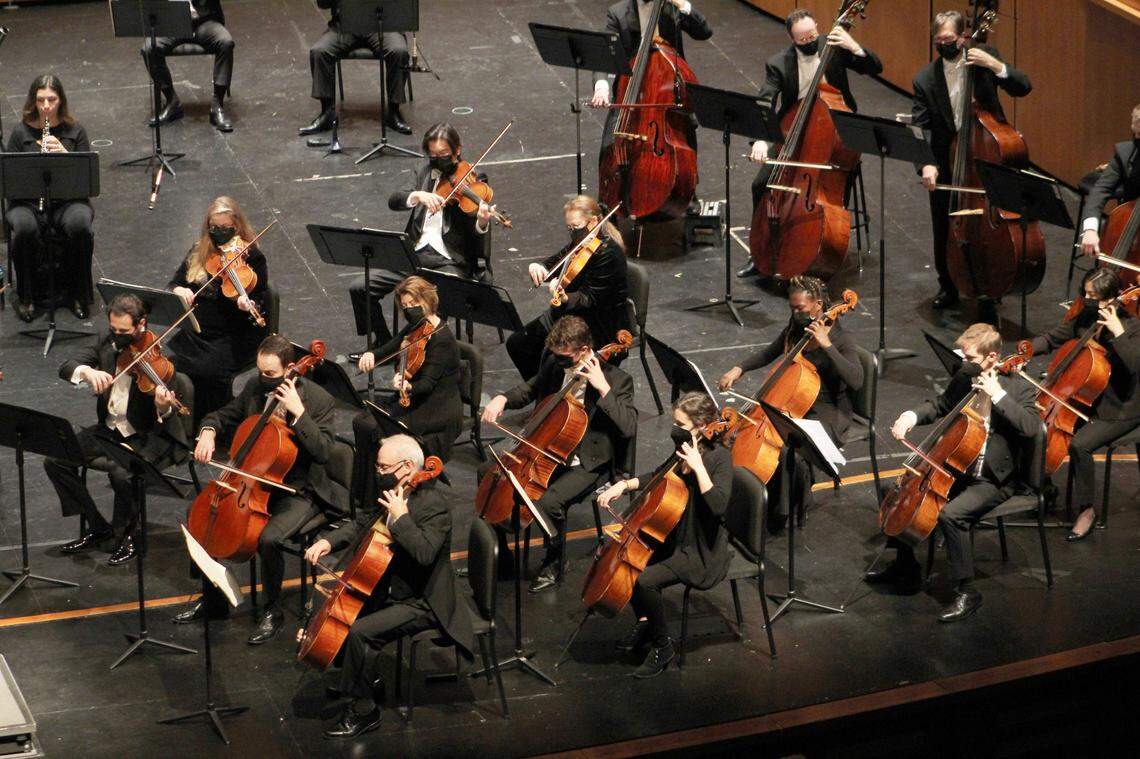 Drew Dansby, second row, third from the left, plays with others in the cello section of the Charlotte Symphony performing Beethoven’s Symphony No. 4 last November.