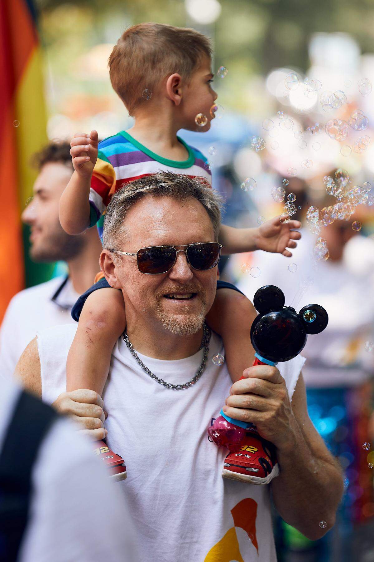 Families take in the sights and sounds during the 25th Charlotte Pride Parade in uptown Charlotte on August 17, 2025.