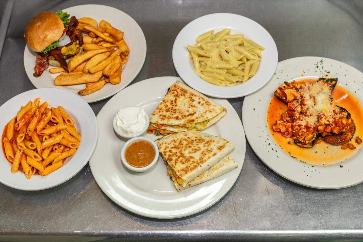 Sir Edmond Halley’s food includes tomato pasta from the kid’s menu, bacon cheeseburger with fries, kids menu butter pasta, stuffed zucchini and a veggie quesadilla.