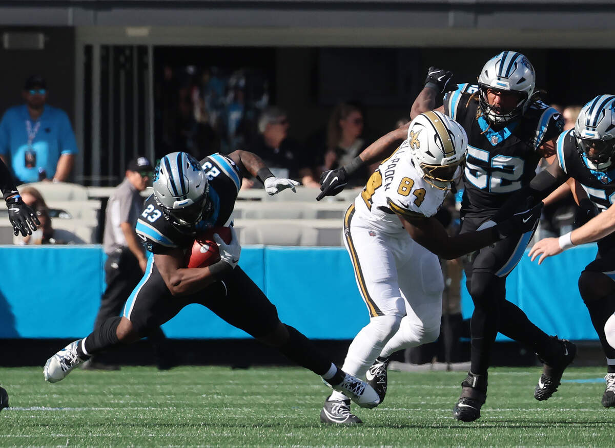 Carolina Panthers Trevor Etienne carries the ball Sunday, Nov. 9, 2025 at Bank of America Stadium in Charlotte.