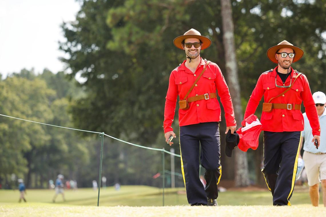 Jesse Boulet and Romeo Boulet, both of Canada, walk the course dressed as Canadian Mounted Police during the Presidents Cup golf tournament at the Quail Hollow Club in Charlotte, N.C., Thursday, Sept. 22, 2022.