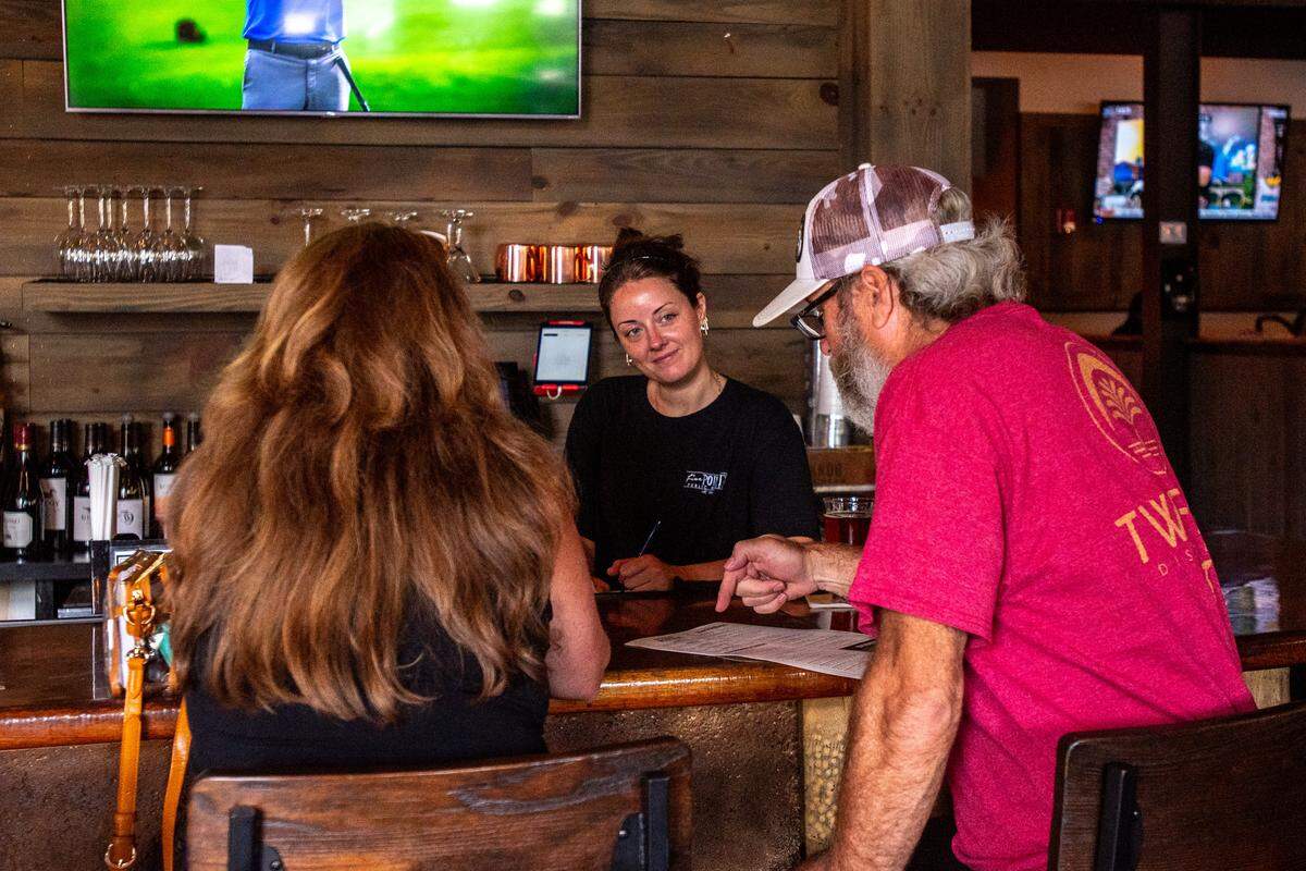 Bri Purvis takes patrons’ orders during the lunch rush at Five Points Public House in Albemarle, one of the top 10 fastest growing areas for its size, according to the U.S. Census Bureau. The restaurant is also an example of how the city is reusing old building. The site used to be a Pontiac dealership.