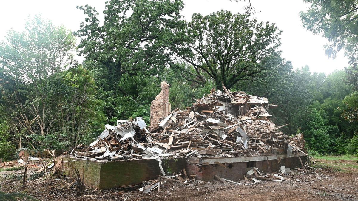 The former Steele Creek Presbyterian Manse home sits in a pile of rubble after being demolished along Steele Creek Road in Charlotte, NC.