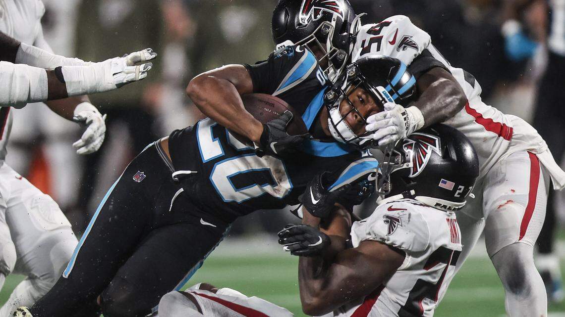 Carolina Panthers running back Raheem Blackshear is tackled by a host of Atlanta Falcons defenders \ on Thursday, November 10, 2022.