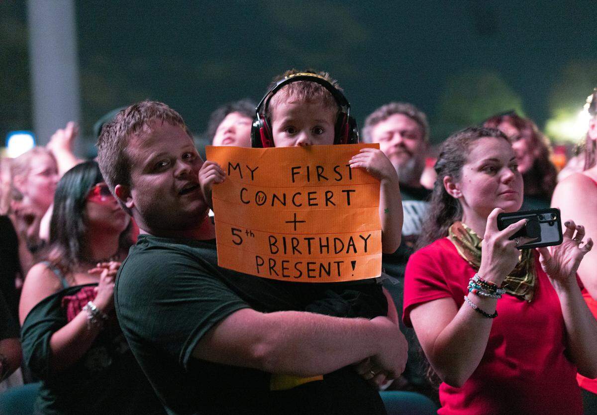 A young fan’s birthday wish comes true at the Twenty One Pilots concert during The Clancy Tour: Breach 2025 at PNC Music Pavilion in Charlotte. The name of the venue is changing to Truliant Amphitheater. 