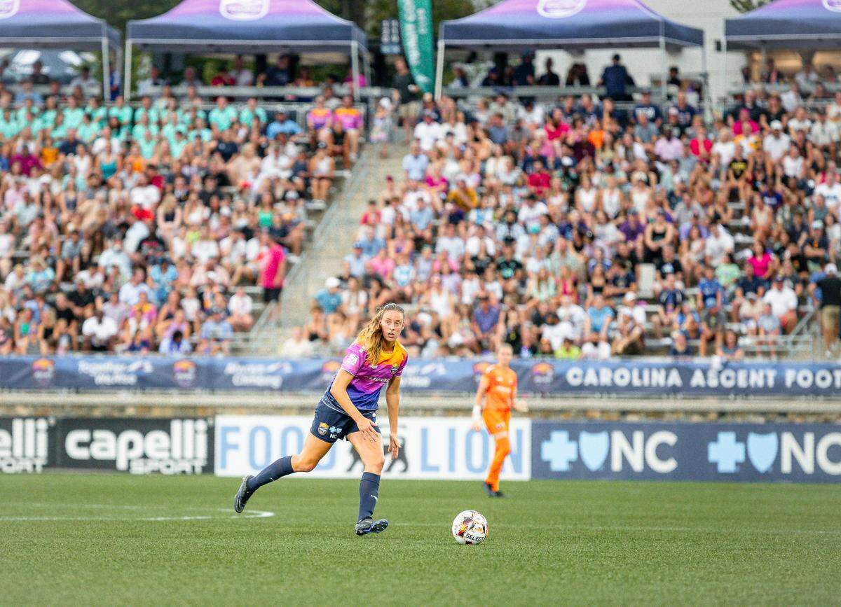 A player for the Carolina Ascent soccer club looks to cross the ball during a USL Super League match against DC Power FC on Saturday night at American Legion Memorial Stadium in Charlotte, NC.