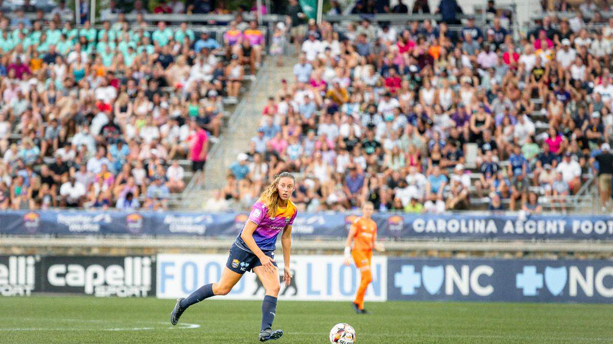 A player for the Carolina Ascent soccer club looks to cross the ball during a USL Super League match against DC Power FC on Saturday night at American Legion Memorial Stadium in Charlotte, NC.