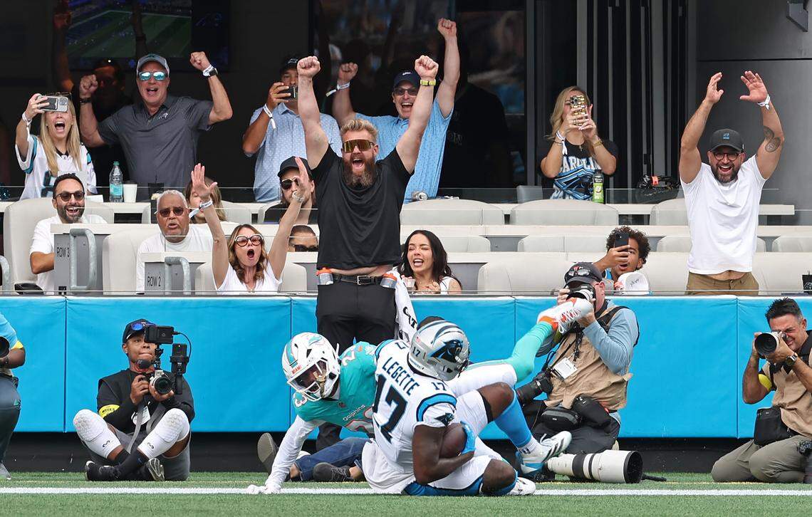 Carolina Panthers fans react to a touchdown pass reception by wide receiver Xavier Legette against Miami Dolphins cornerback Jack Jones during action on Sunday, October 5, 2025 at Bank of America Stadium in Charlotte, NC. The Panthers defeated the Dolphins 27-24.  