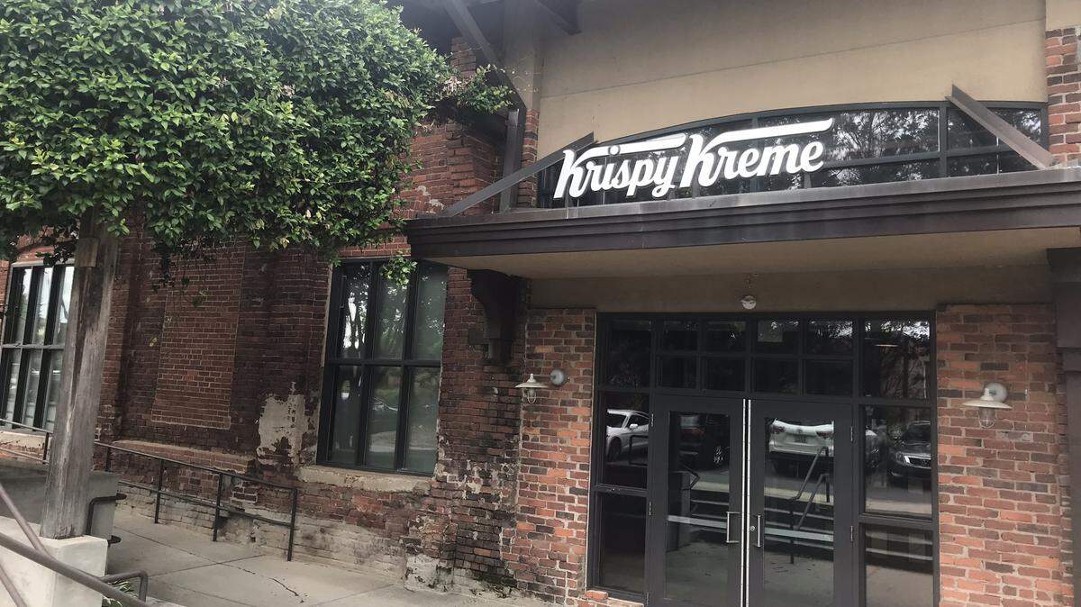 Krispy Kreme has quietly opened its new corporate offices in a refurbished South End warehouse that dates back to the 1900s.