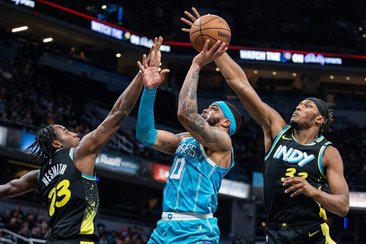 Indiana Pacers center Myles Turner (33) blocks the shot of Charlotte Hornets forward Miles Bridges (0) in the second quarter at Gainbridge Fieldhouse.