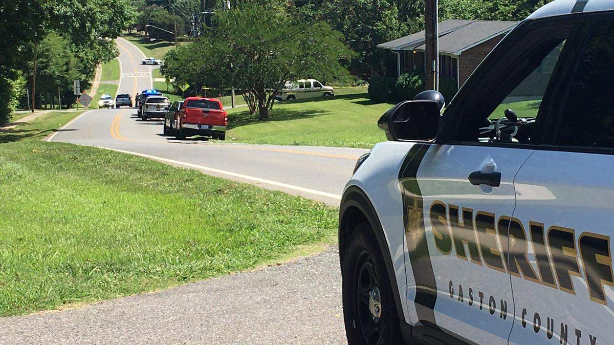 Crime tape surrounds a home in Bessemer City on Wednesday, June 16, 2021, after police say officers shot and killed a man who fled as they tried to arrest him on outstanding warrants.