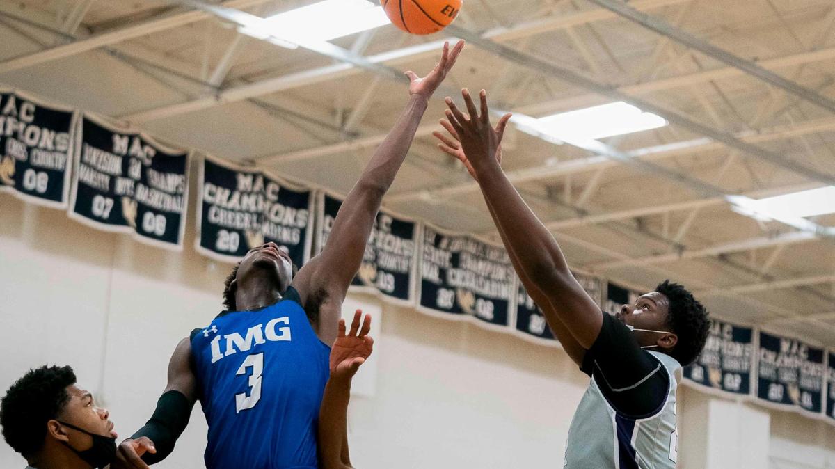 IMG’s Eric Dailey (3) gets the offensive rebound at the Hoops-Mas Tournament in Rock Hill Tuesday December 22, 2020.
