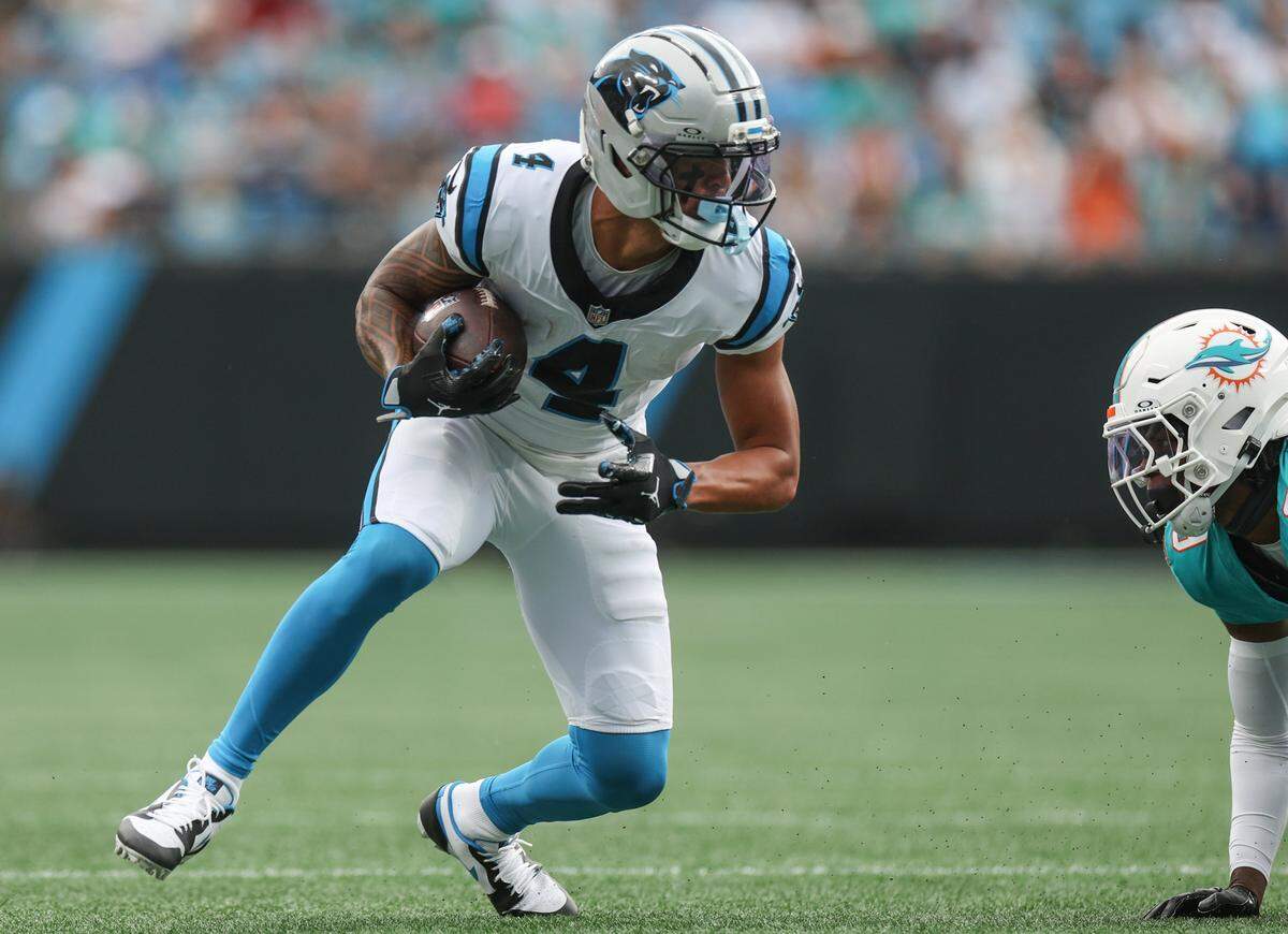 Panthers wide receiver Tetairoa McMillan, left, catches a pass during the game against the Dolphins at Bank of America Stadium in Charlotte, NC on Sunday, October 5, 2025