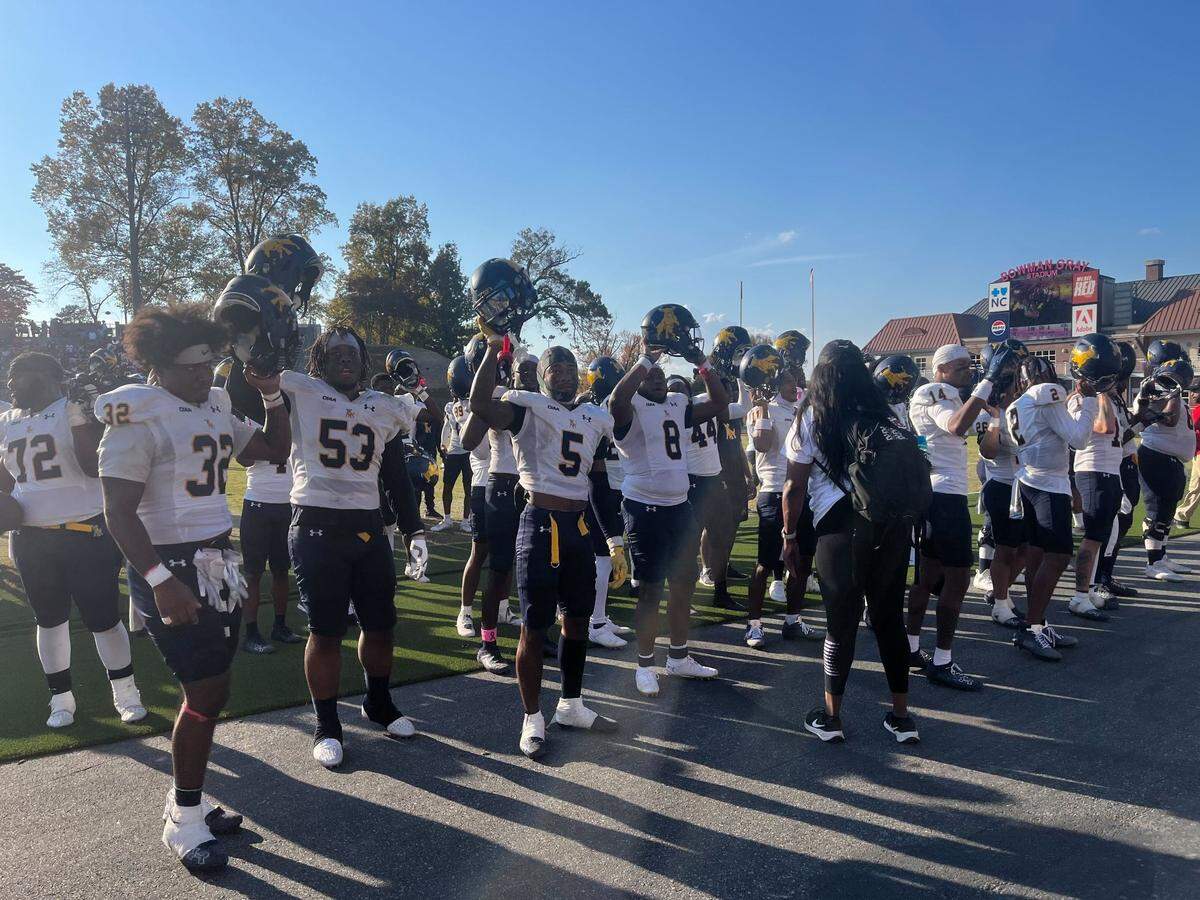 The Johnson C. Smith football team celebrates with its band, cheerleaders and fans as the school’s alma mater plays following its victory over Winston-Salem State at Bowman Gray Stadium in Winston-Salem, N.C., on Oct. 26.