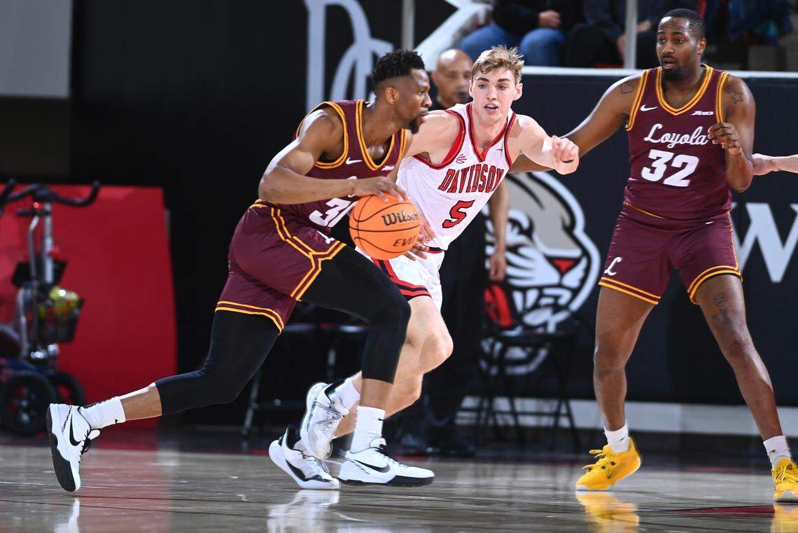 Davidson men’s basketball senior Grant Huffman defends a Loyola Chicago player on Senior Night on Tuesday, March 6, 2024, in John M. Belk Arena.