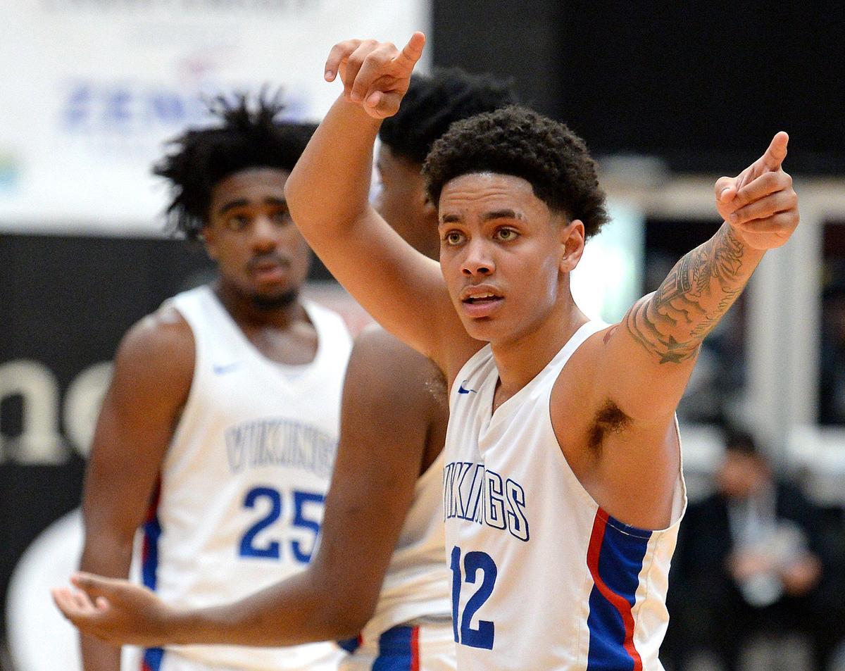 North Mecklenburg’s Tristan Maxwell points during his team’s 86-78 win over Olympic Saturday. North Meck will play Lumberton next Saturday in Chapel Hill for the 4A championship.