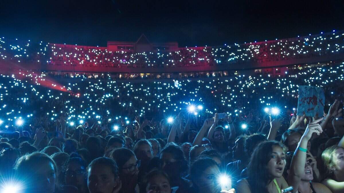 Some performers would prefer not to have to look out into a crowd of people holding up their cellphones.