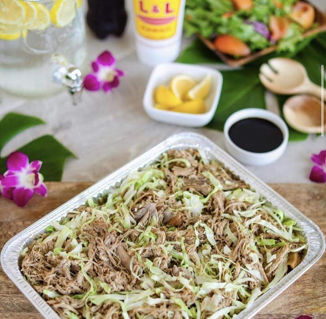 Kalua Pork, a popular menu item at L&L Hawaiian, is a slow-roasted shredded pork served with cabbage.