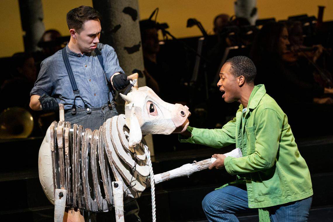 Pupeteer Kennedy Kanagawa with the cow Milky White, who belongs to Cole Thompson’s Jack in “Into the Woods.” The poor cow plays a pivotal part in the show.