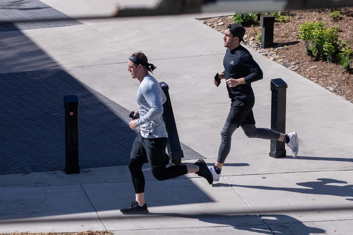 Runners burn calories along Charlotte’s Rail Trail path in South End on Thursday, April 2, 2020.