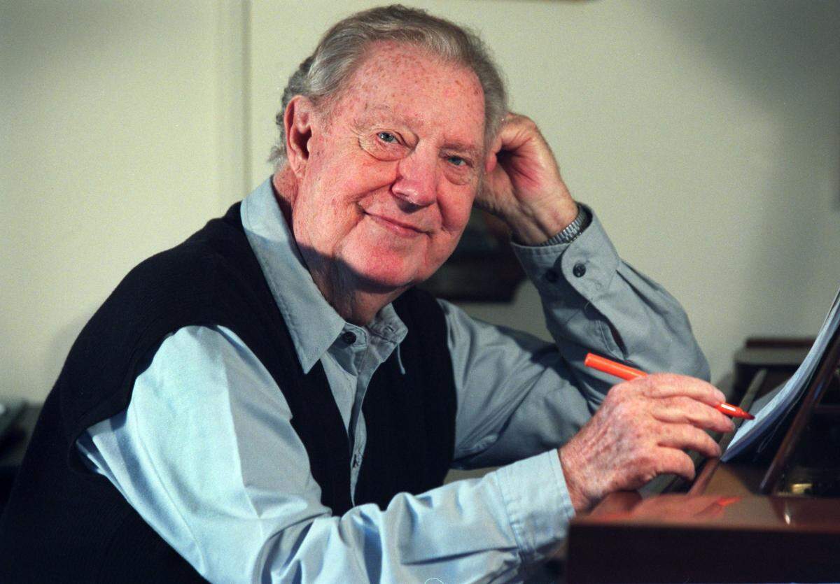 Loonis McGlohon poses in the music studio at his Charlotte home on Nov. 29, 2001. A bronze statue of the late jazz musician is planned for the city’s Trail of History.
