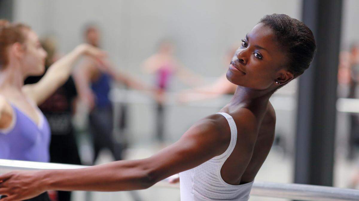 Victoria Jaenson dances at the barre in a daily technique class.