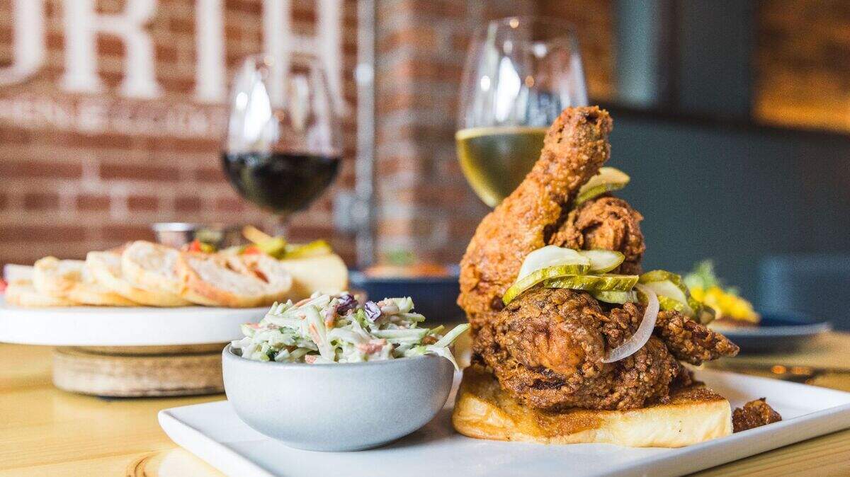 204 North Kitchen and Cocktails’ Nashville Hot Chicken is a breast and bone-in thigh, served over seared Hawaiian bread with a slaw made from Brussels sprouts and Napa cabbage.