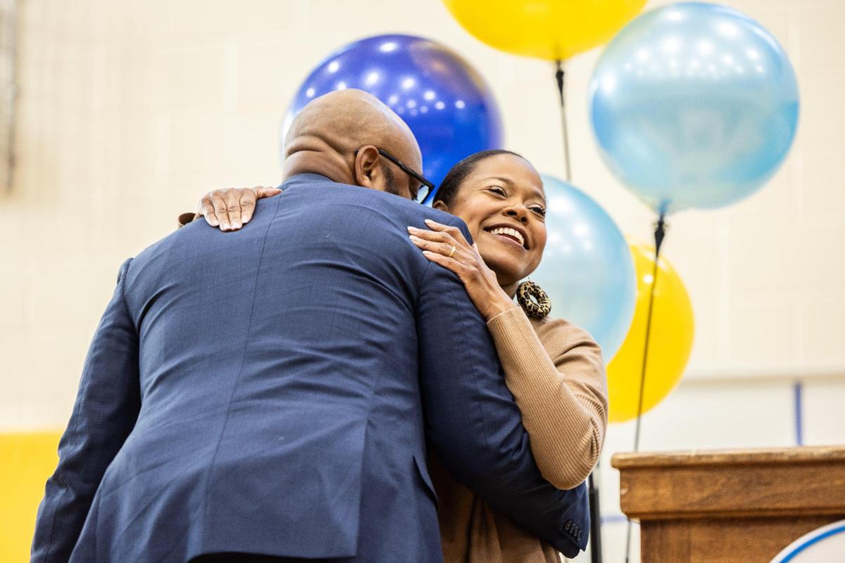 Superintendent Dr. Crystal Hill, right, gives Principal Dwight Thompson a hug before announcing him as Charlotte-Mecklenburg Schools’ principal of the year at Renaissance West STEAM Academy in Charlotte, N.C., on Thursday, November 2, 2023.