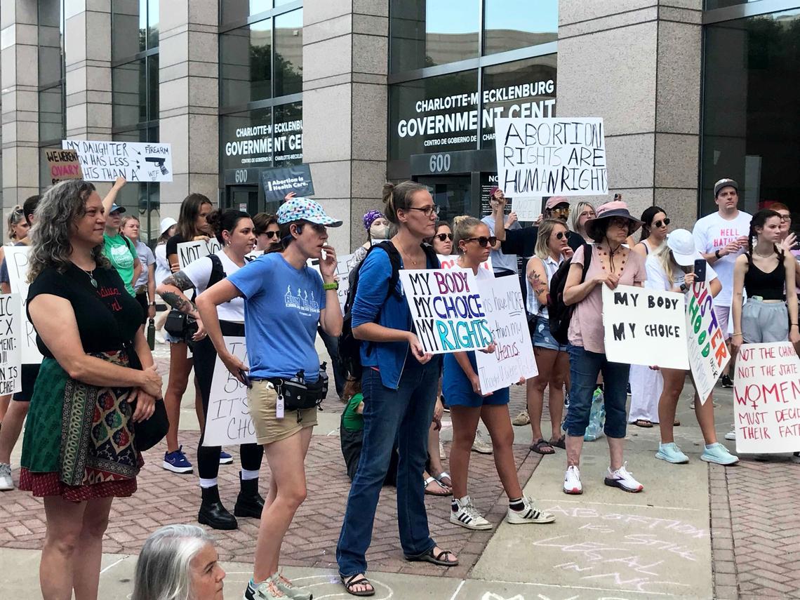 Demonstrators gathered outside the Charlotte-Mecklenburg Government Center during a protest Friday evening to protest the U.S. Supreme Court’s decision to overturn Roe v. Wade, ending the constitutional right to an abortion.