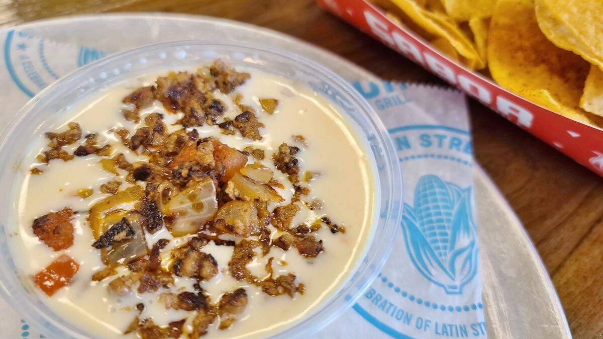 Creamy queso topped with spicy chorizo served with house-made chips, from Sabor Latin Grill’s secret menu.