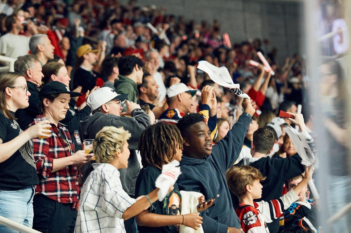 Fans celebrate after the Checkers open the scoring in Sunday’s first period against the Laval Rocket.