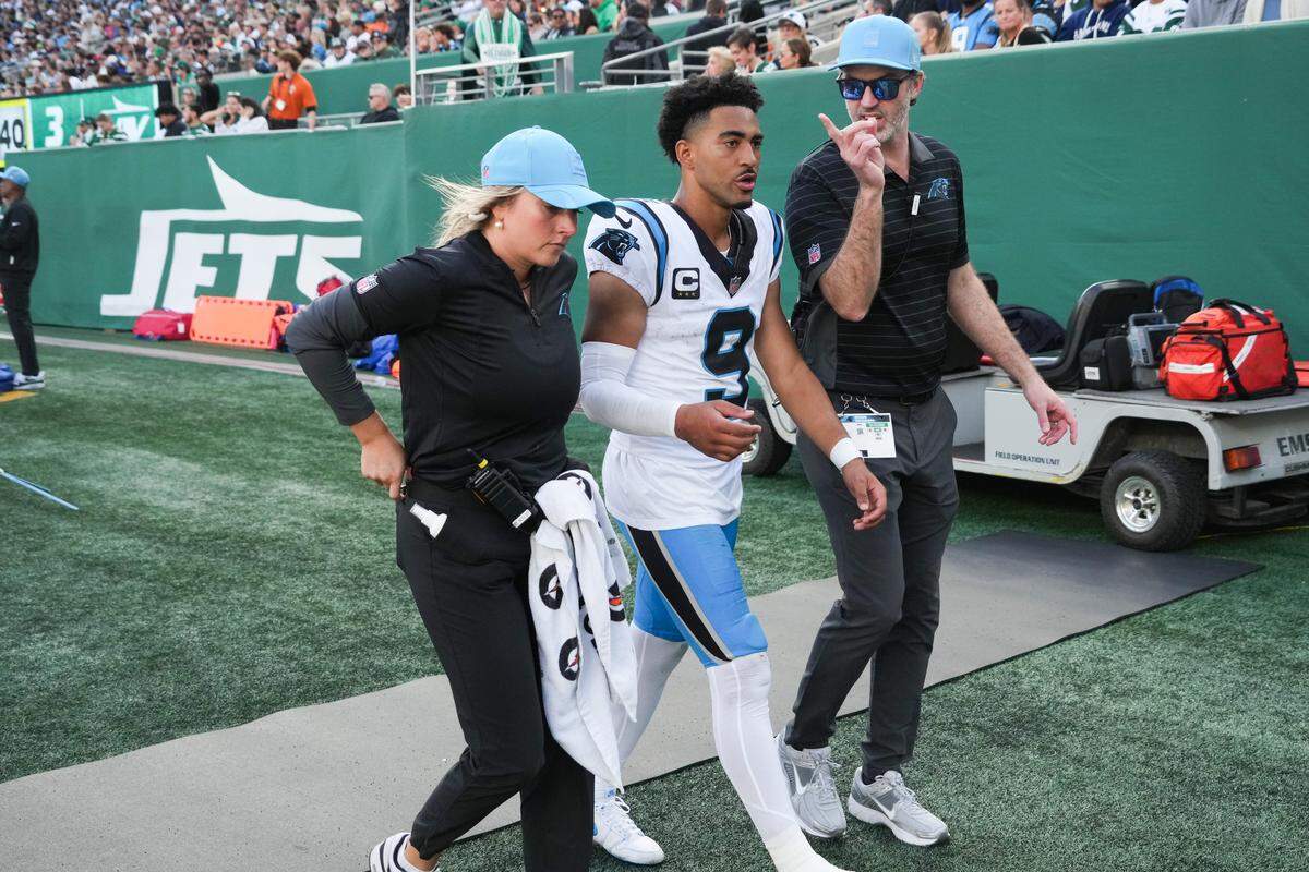 Oct 19, 2025; East Rutherford, New Jersey, USA; Carolina Panthers quarterback Bryce Young (9) exits the field during the third quarter against the New York Jets at MetLife Stadium. Young had an ankle injury and did not return.