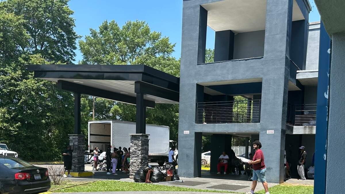 People living at an east Charlotte hotel near Sugar Creek were loading their belongings into the back of a moving truck Monday afternoon.