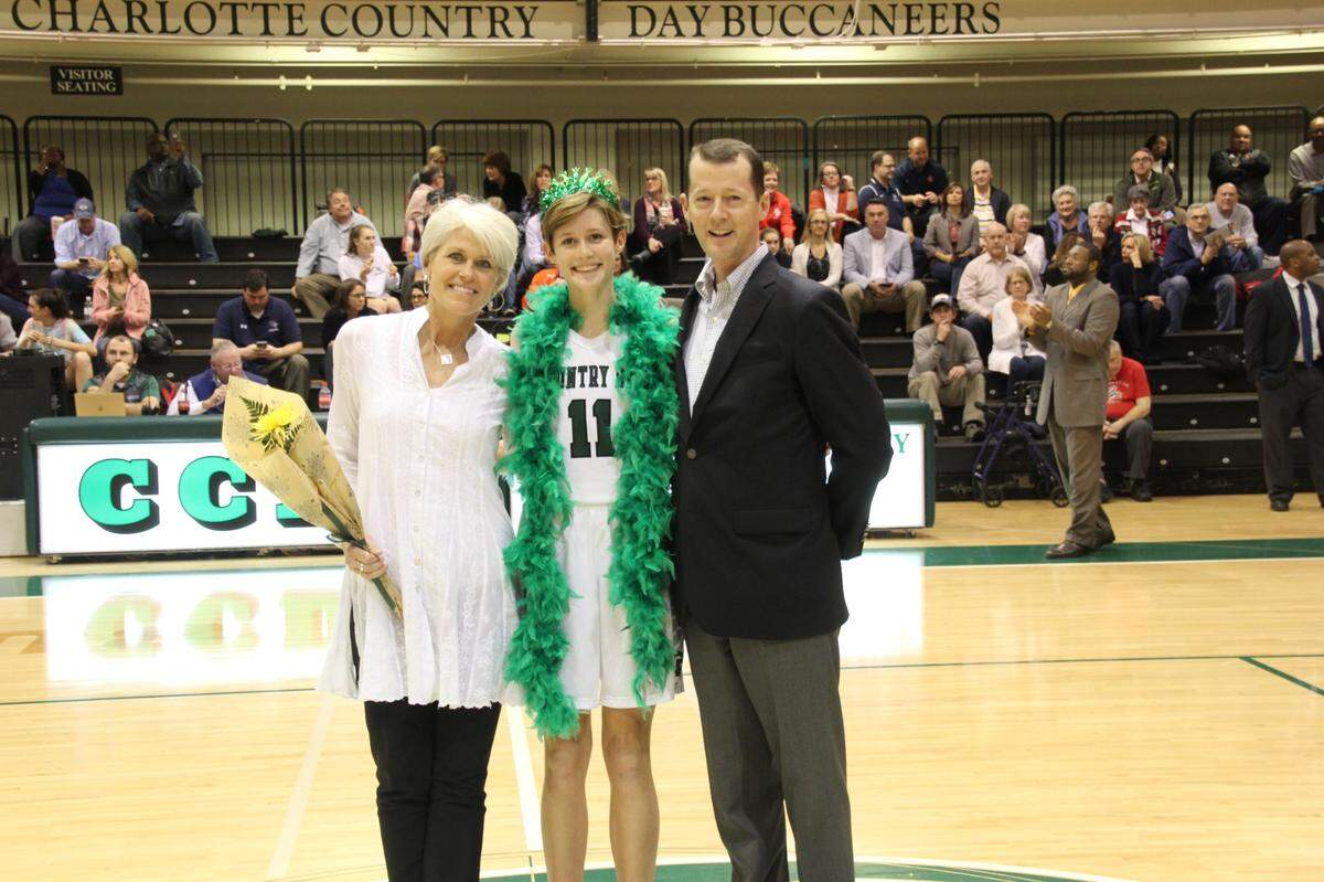 Sally Sasz with her parents, Steve and Nancy Sasz. Sally Sasz played varsity basketball for four years at Charlotte Country Day School.